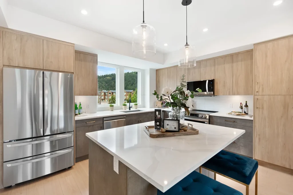 Kitchen area showcasing the island, modern cabinets and appliances